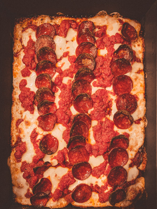 Overhead view of Serious Eats Detroit Style pizza fresh from the oven.