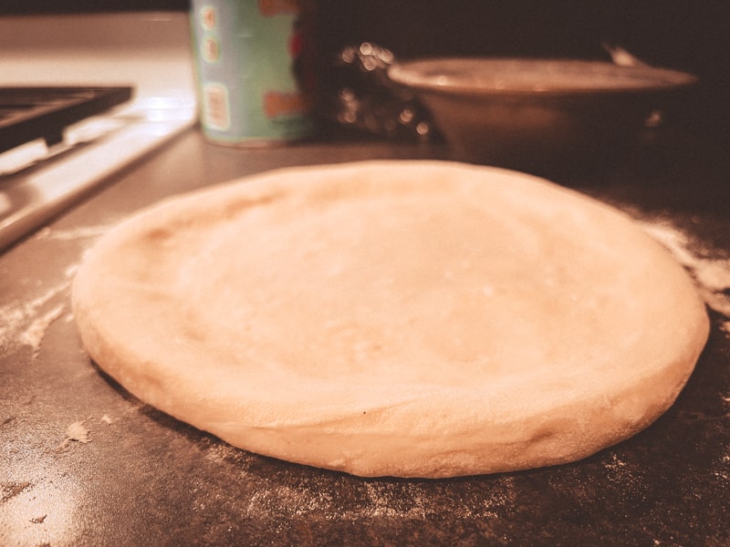 Stretched Neapolitan style pizza dough.