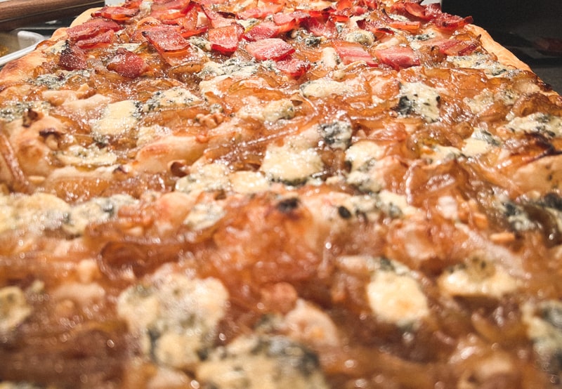 caramelized onion and blue cheese pizza close up